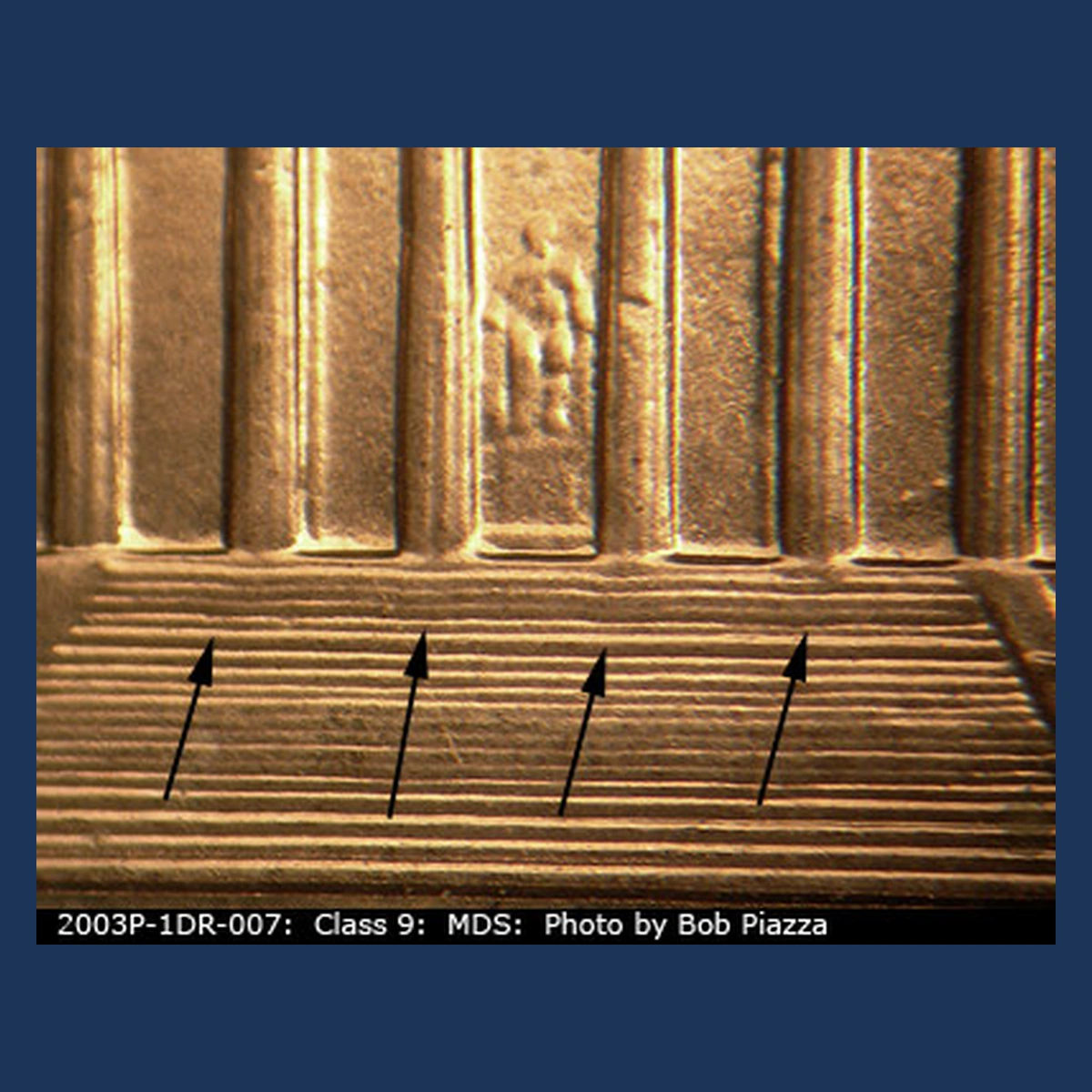2003 Lincoln Cent (Modern): wavy steps from a design-extension anomaly