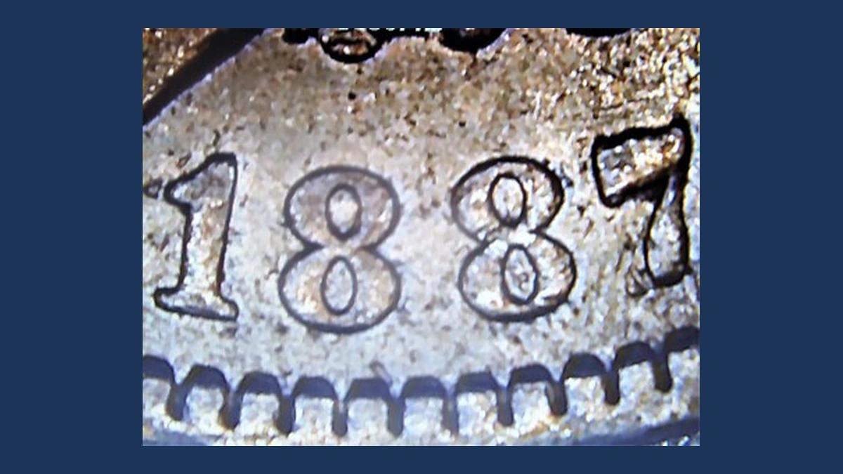 1887 Morgan Dollar: Repunched Date