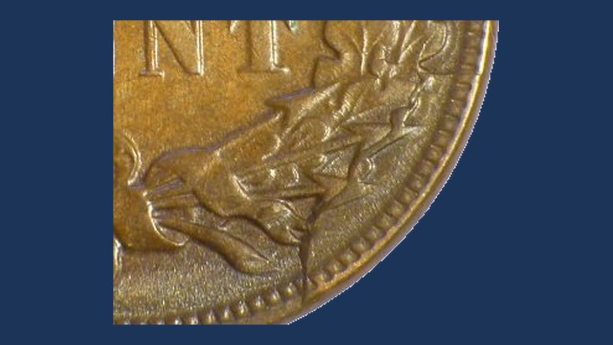 1883 Indian Head Penny: Die Break / Cud