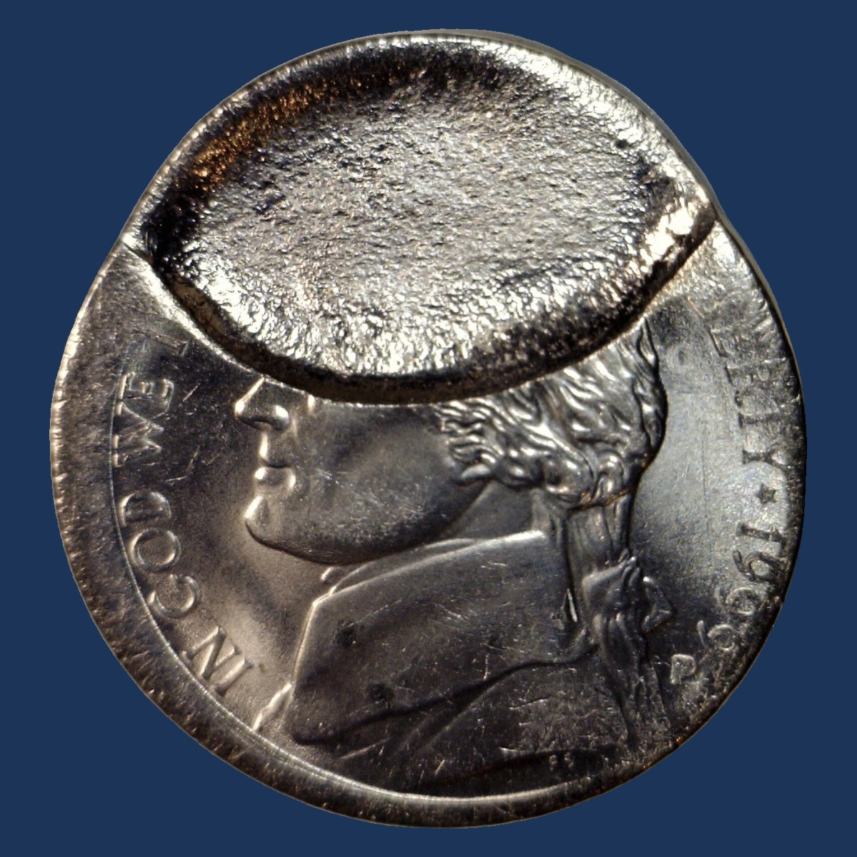 1999 Jefferson Nickel: indent from an overlapping blank