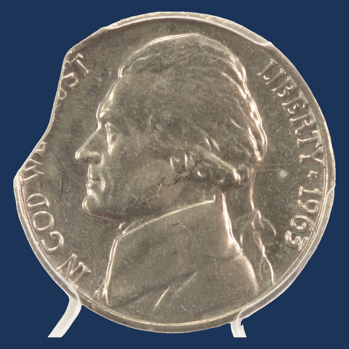 1963 Jefferson Nickel: Curved clipped planchet