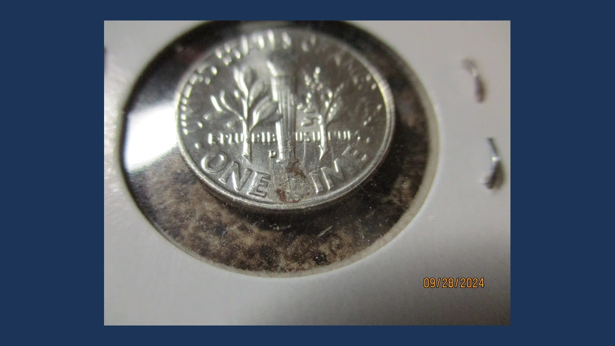 1957 Roosevelt Dime: Struck Through